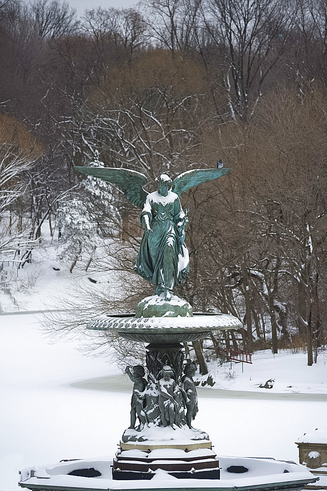 Snow covered statue at Bethesda Fountain in Central Park, New York City, New York State, United States of America, North America