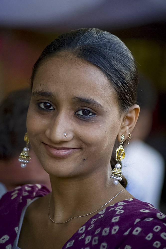 A young girl wearing elaborate earings in Jodhpur, Rajasthan, India, Asia