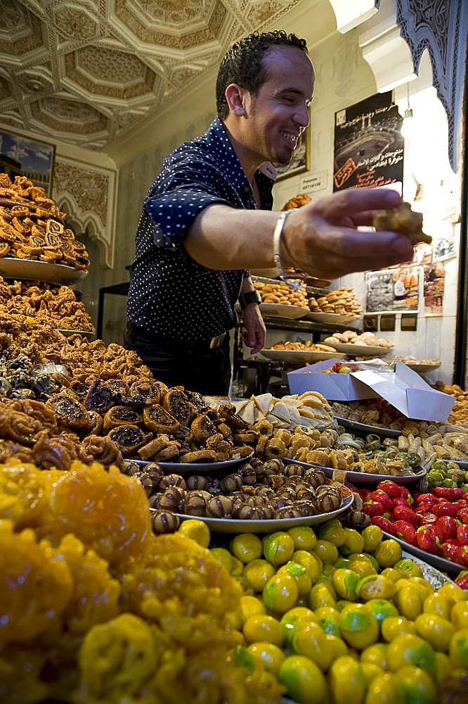 A stall selling colourful sweets in the souk in Marrakech, Morocco, North Africa, Africa