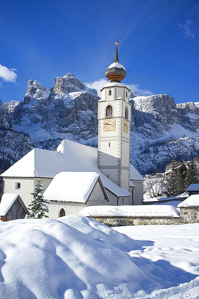 A church in Colfosco in Badia near the Sella Massif mountain range in the Dolomites, South Tyrol, Italy, Europe