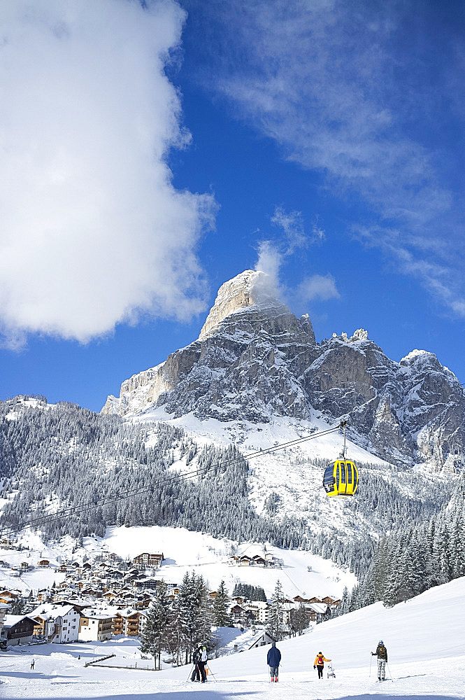 A view toward the town of Corvara and gondola at the Alta Badia ski resort with Sassongher Mountain behind, Dolomites, South Tyrol, Italy, Europe