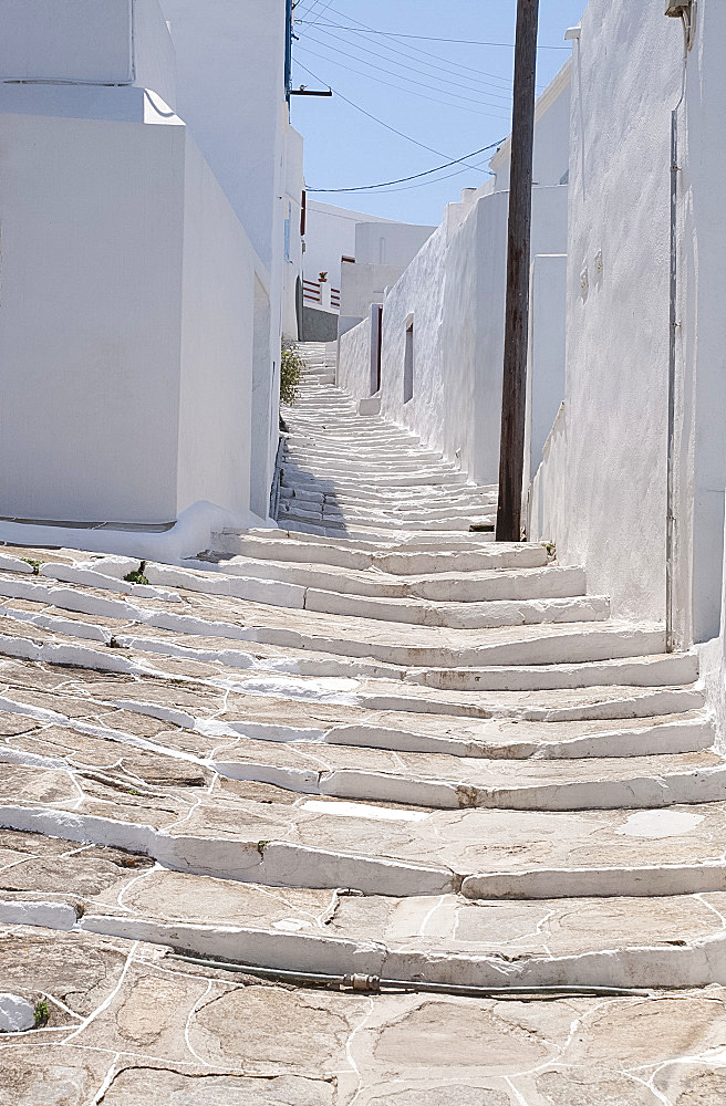 Stone steps up a path through the houses of Pano Petali in Sifnos, The Cyclades, Greek Islands, Greece, Europe