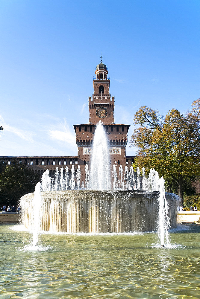 A fountain in front of the Torre del Filrete clock tower on the Castello Sforzesco, Milan, Lombardy, Italy, Europe