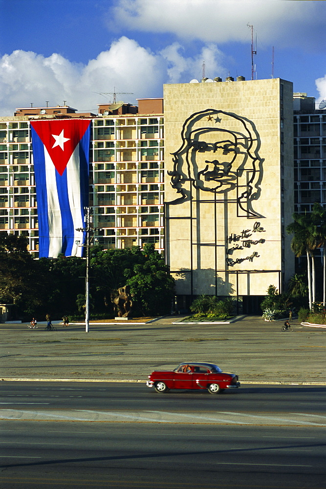 Cuban flag outside the Ministerio del Interior at Plaza de la Revolucion, Havana, Cuba, West Indies, Central America