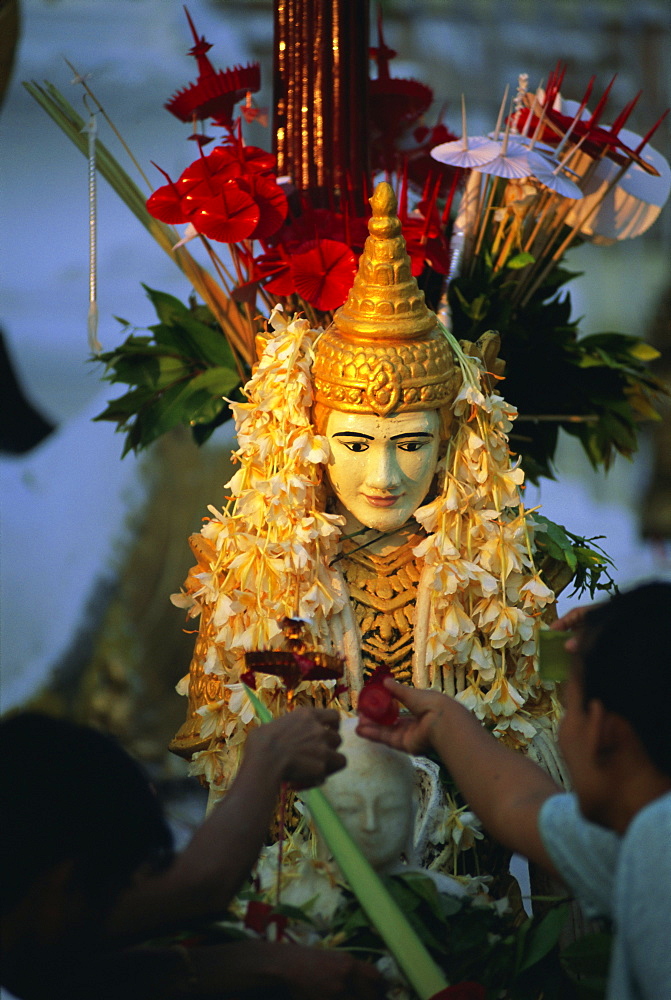 Religious offerings at the Shwedagon Paya (Shwe Dagon Pagoda), Yangon (Rangoon), Myanmar (Burma), Asia