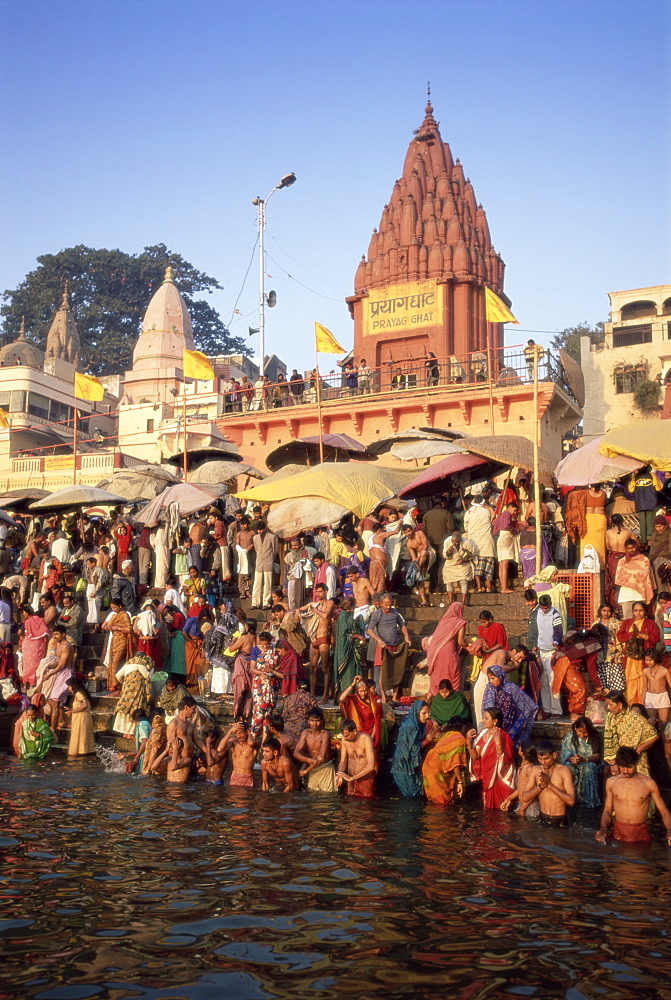 Hindus bathing in the early morning in the holy river Ganges (Ganga) along Dasaswamedh Ghat, Varanasi (Benares), Uttar Pradesh state, India, Asia