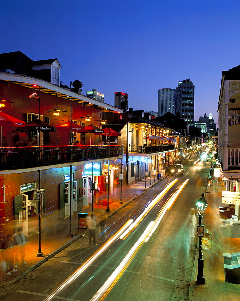 Bourbon Street and city skyline at night, New Orleans, Louisiana, United States of America, North America