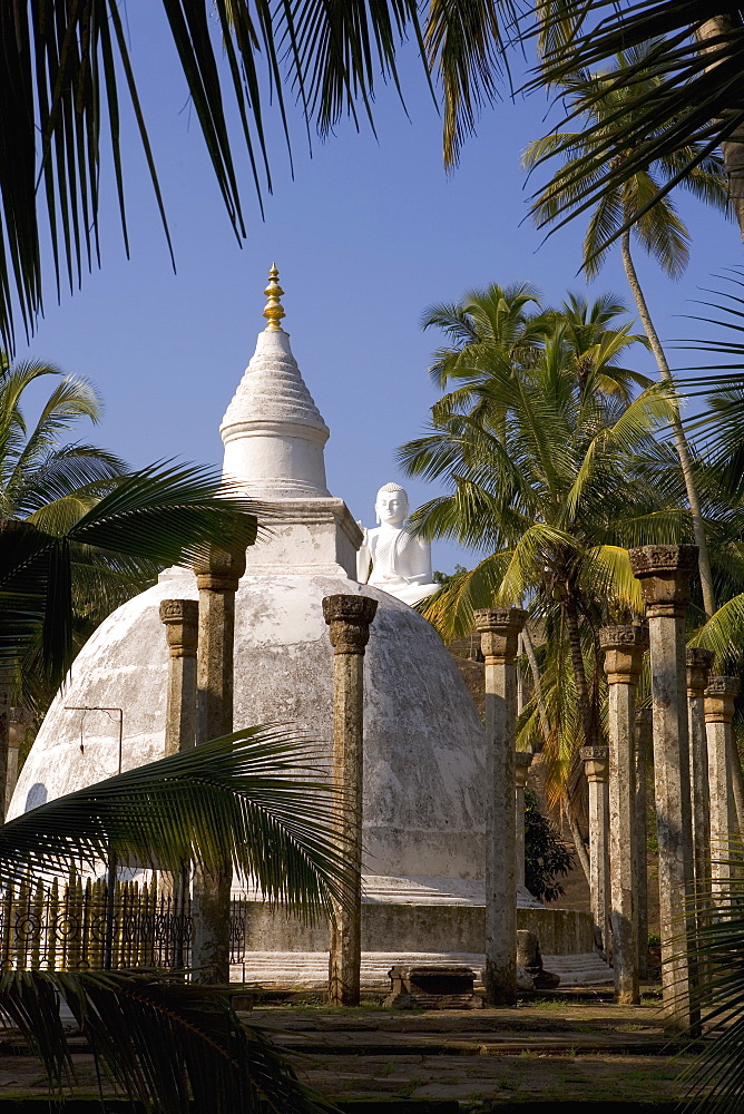 Great seated Buddha statue and dagoba (stupa) at Mihintale, where Buddhism first arrived in Sri Lanka, Mihintale, Sri Lanka, Asia