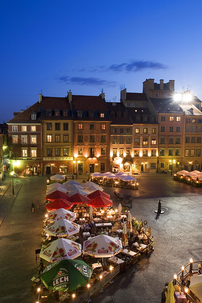 Elevated view over the square and outdoor restaurants and cafes at dusk, Old Town Square (Rynek Stare Miasto), UNESCO World Heritage Site, Warsaw, Poland, Europe