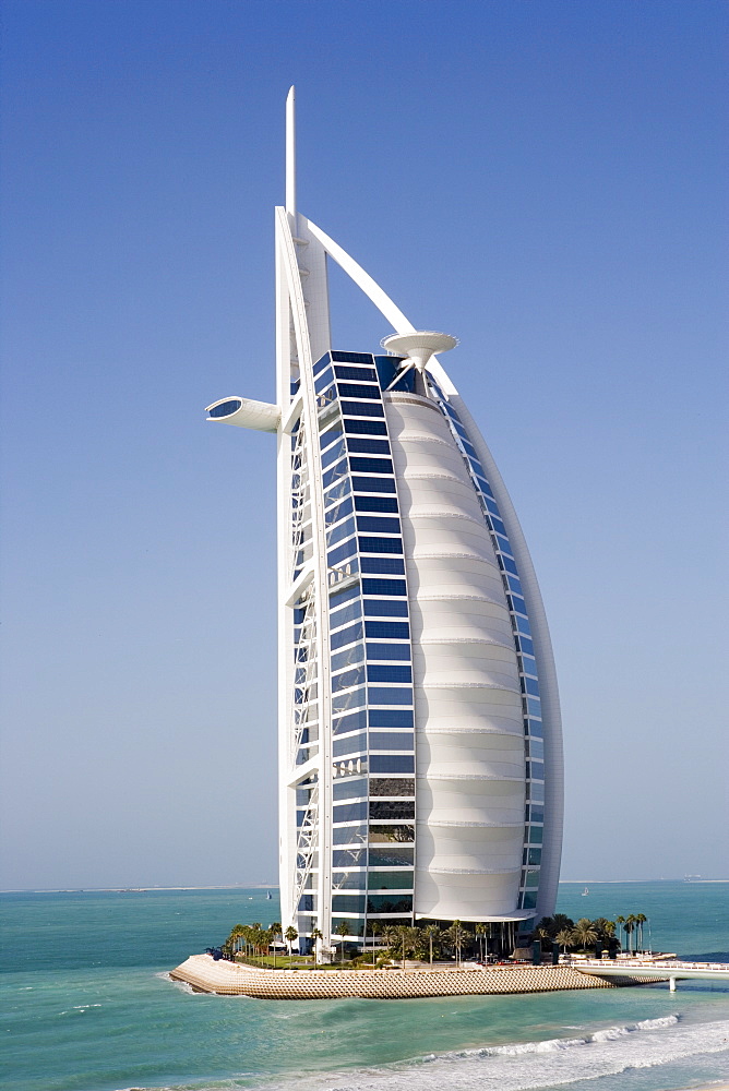 The iconic symbol of Dubai, the Burj Al Arab, the world's first seven star hotel (classified as five star deluxe), built on an artificial island offshore from the Jumeirah Beach Hotel, Dubai, United Arab Emirates, Middle East