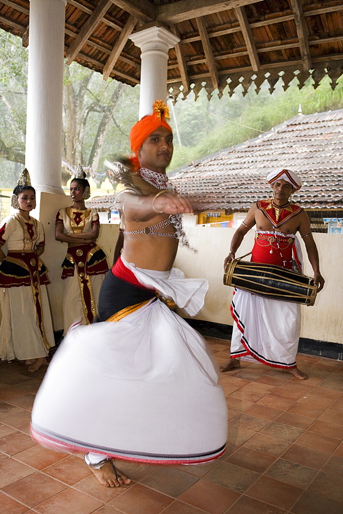 Kandyan Dance, considered the National Dance of Sri Lanka, the dancers are accompanied by drummers on the geta bera, Kandy, Hill Country, Sri Lanka, Asia