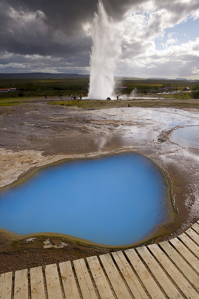 Strokkur (the Churn) which spouts up to 35 meters erupting every 10 minutes, Geysir, Golden Circle, Iceland, Polar Regions