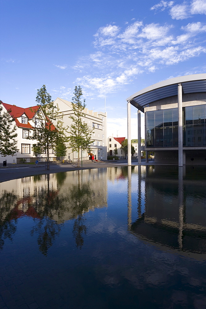 The Radhus (City Hall), an angular construction of concrete, glass and carved lava, Lake Tjorn, Central area, Reykjavik, Iceland, Polar Regions