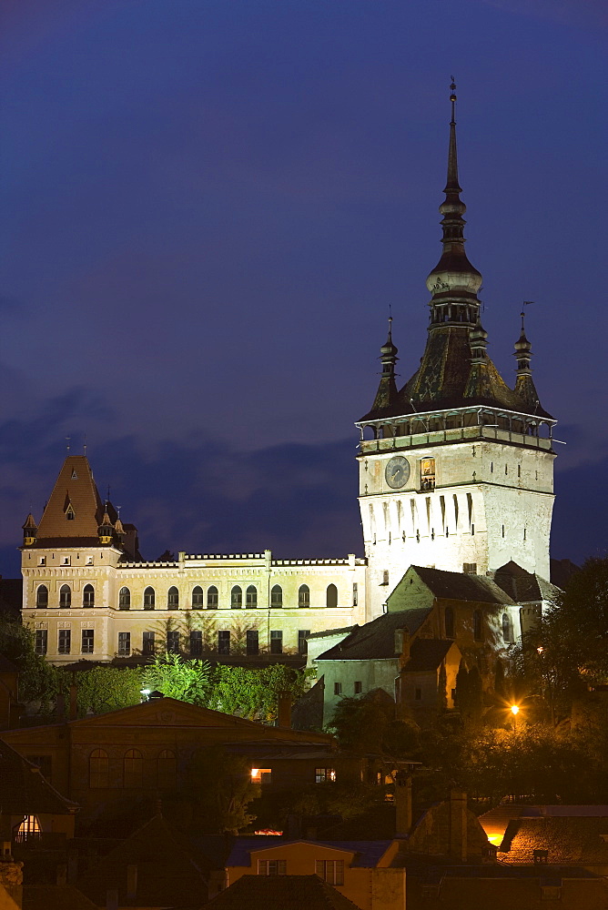 Clock tower (Turnul cu Ceas), illuminated at dusk, formerly the main entrance to the fortified city, in the medieval old town or citadel, Sighisoara, UNESCO World Heritage Site, Transylvania, Romania, Europe