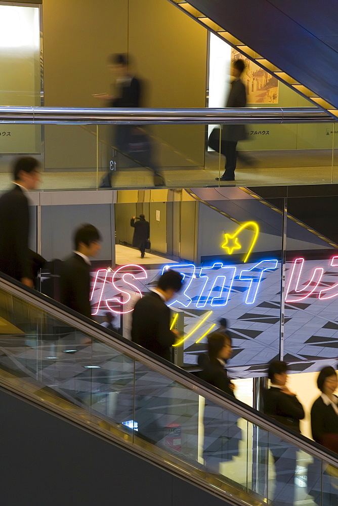 People on an elevator inside the Shinjuku NS Building, Shinjuku, Tokyo, Honshu, Japan, Asia