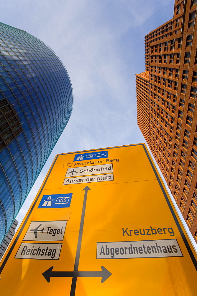 Low angle view of traffic sign and skyscrapers, Potsdamer Platz, Berlin, Germany, Europe