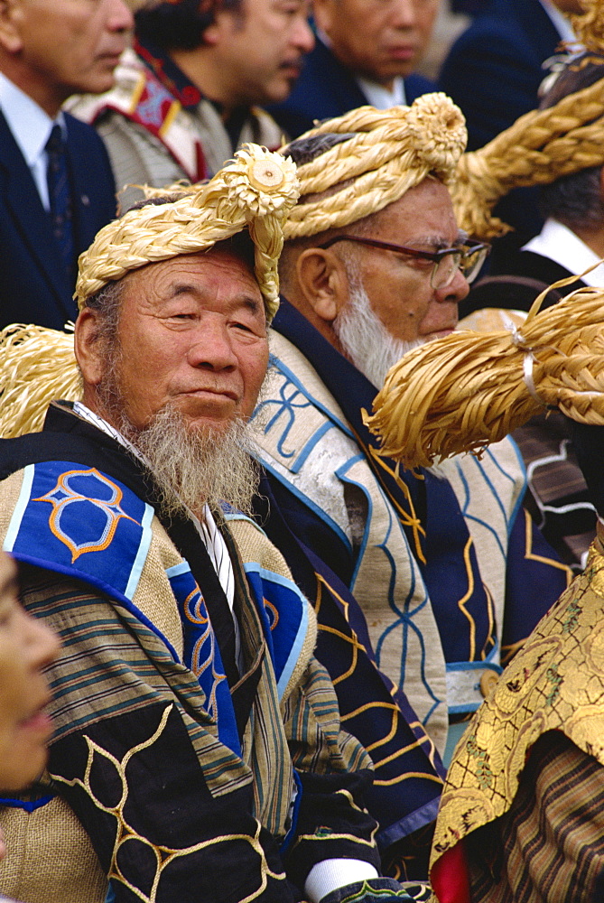 Portrait of an Ainu man in a group in traditional dress at the Marimo festival at Akan Kohan, Hokkaido, Japan, Asia