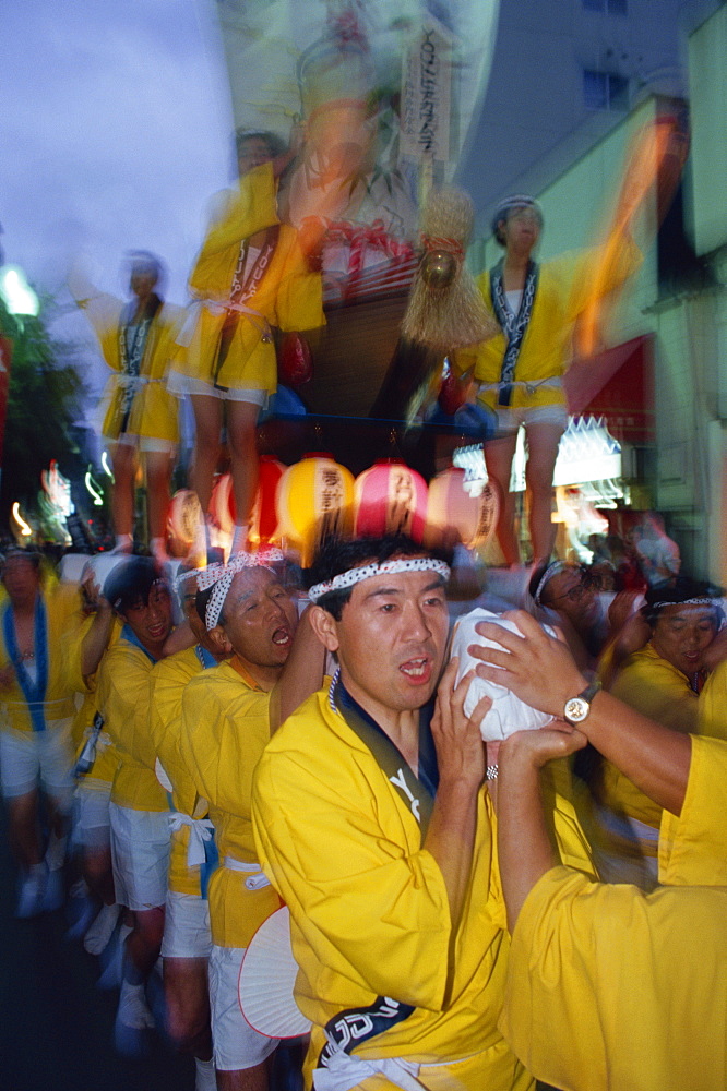 A group of men carrying a shrine during Mikoshi, portable shrine festival, in Asahikawa, Japan, Asia