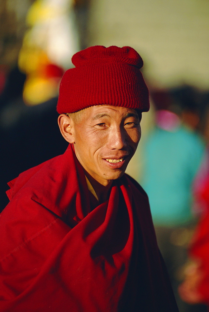 Portrait of a man in red, Lhasa, Tibet, China, Asia