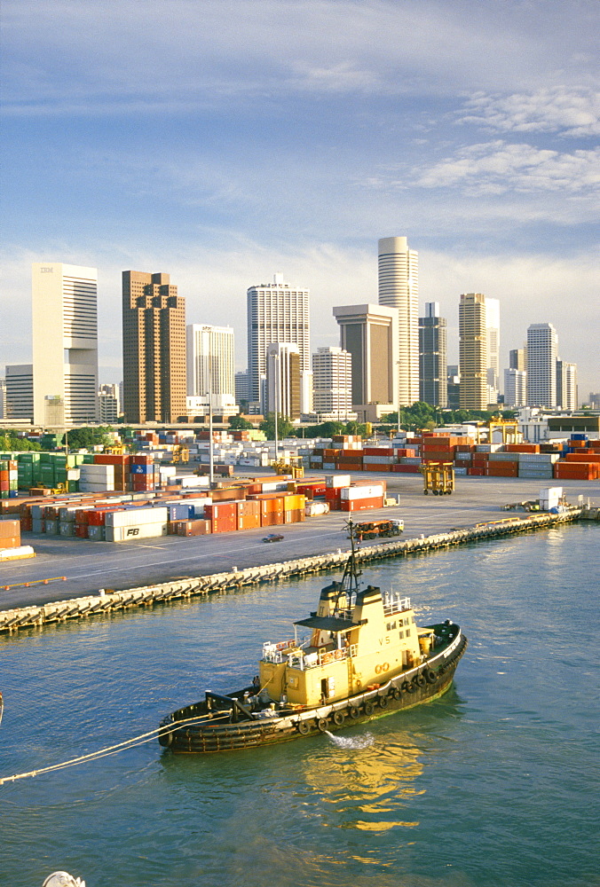 Containers on dockside and city skyline, Singapore, Southeast Asia, Asia