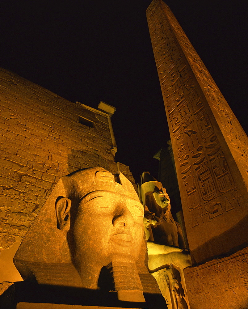 Ramses II and the Obelisk at Luxor Temple, illuminated at night, Luxor, Thebes, UNESCO World Heritage Site, Egypt, North Africa, Africa