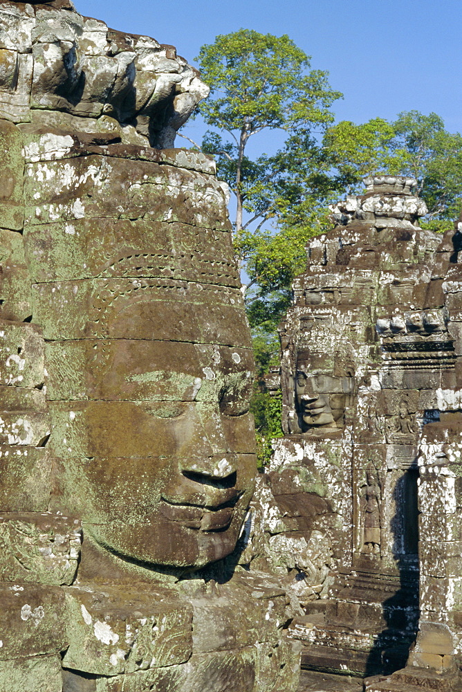 Myriad stone heads typifying Cambodia in the Bayon Temple, Angkor, Siem Reap, Cambodia