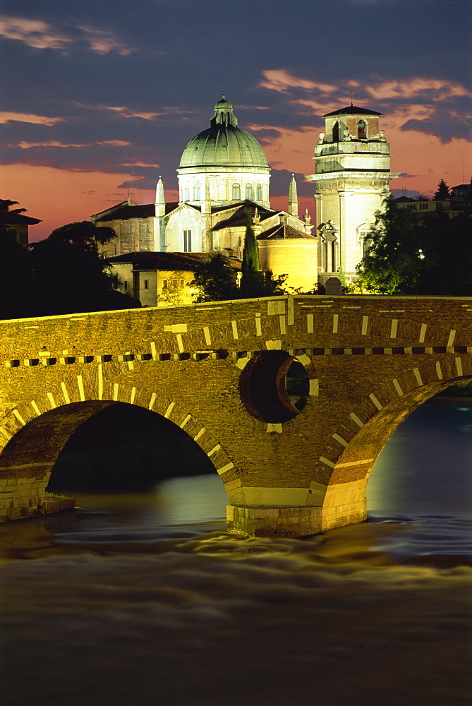 The Ponte Pietra Bridge and Adige River at dusk in the town of Verona, Veneto, Italy, Europe