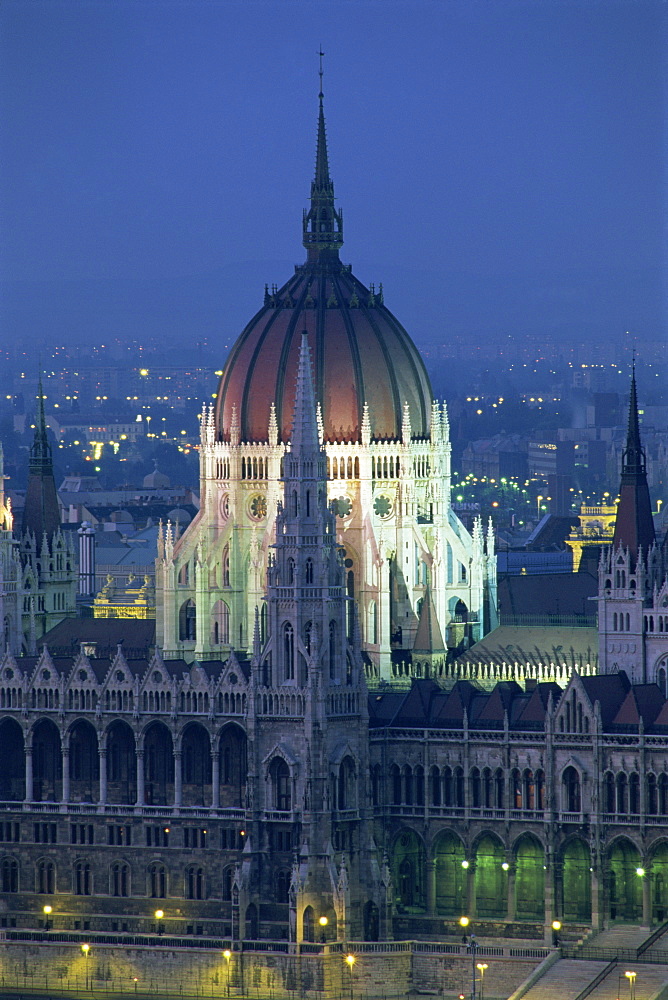 The dome and spires of the Parliament Building illuminated at dusk in Budapest, UNESCO World Heritage Site, Hungary, Europe