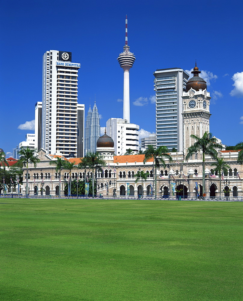 The city skyline from Merdeka Square with the Sultan Abdul Samad Building and Petronas Towers in the centre of Kuala Lumpur, Malaysia, Southeast Asia, Asia