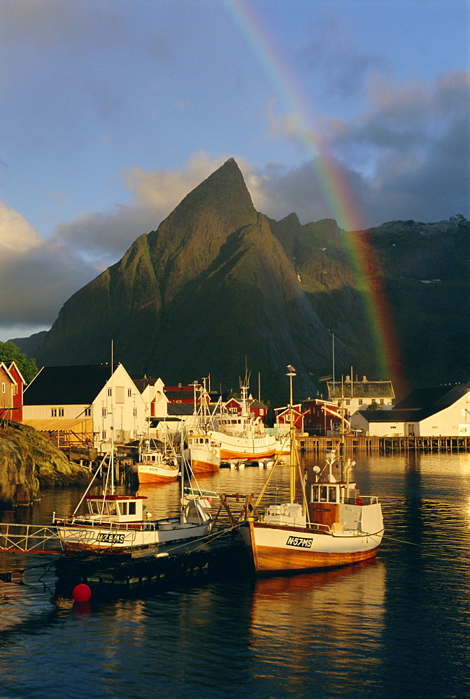 Rainbow over the colourful fishing village of Hamnoy, Moskenesoya, Lofoten Islands, Nordland, Norway, Scandinavia, Europe