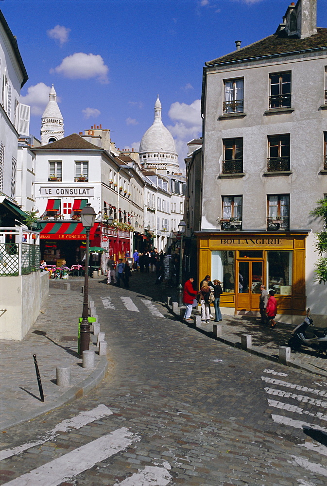 Street scene and the dome of the basilica of Sacre Coeur, Montmartre, Paris, France, Europe