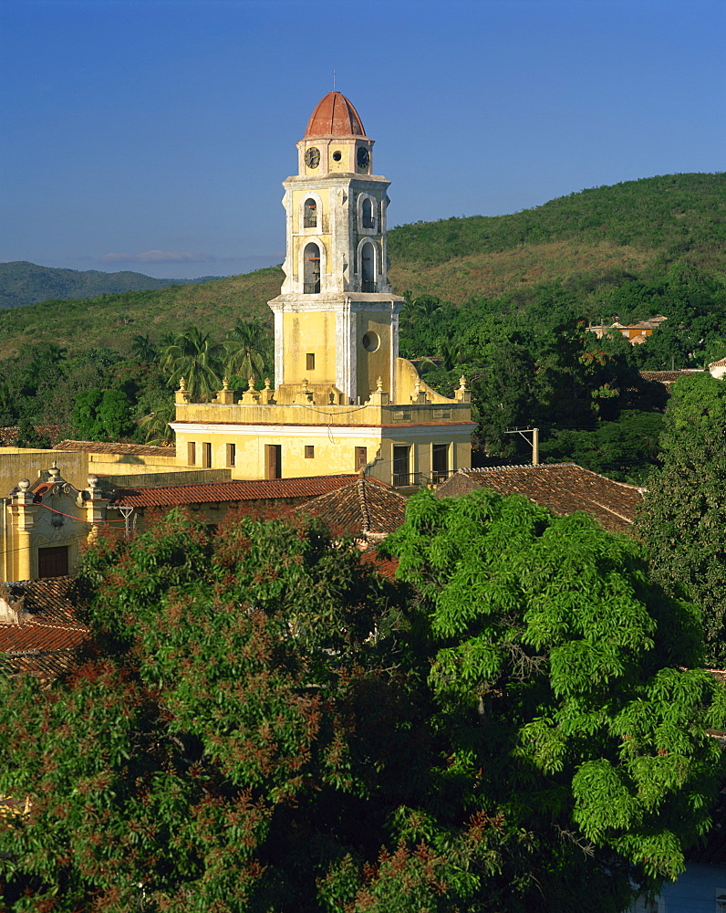 Tower of St. Francis of Assisi Convent church in the Old town, and hills behind at Trinidad, Cuba, West Indies, Caribbean, Central America