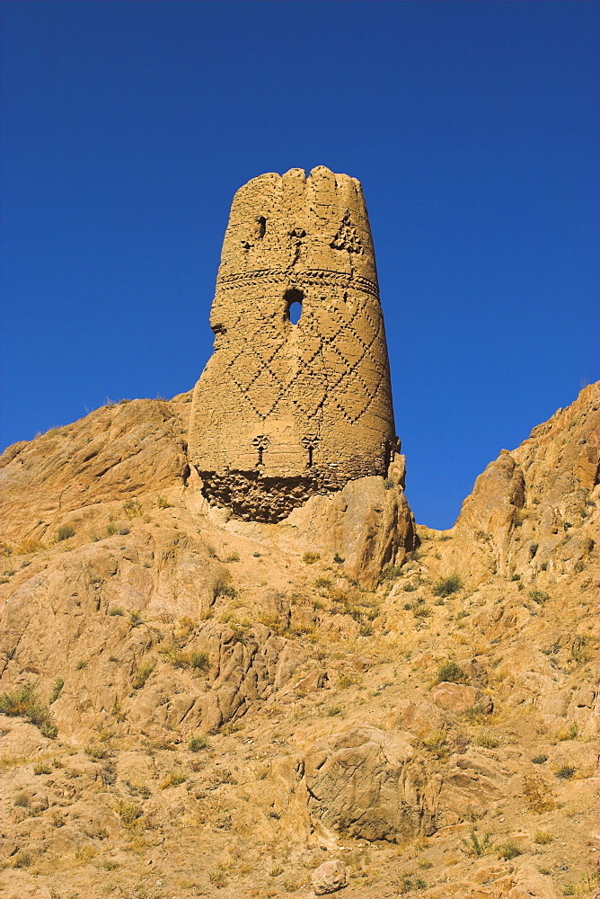 Watchtower at ruins which were once the site of a tall standing Buddha in a niche, Kakrak valley, Bamiyan, Afghanistan, Asia