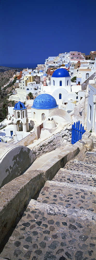 Village of Oia with blue-domed churches and whitewashed buildings, Santorini, Cyclades, Greek Islands, Greece, Europe