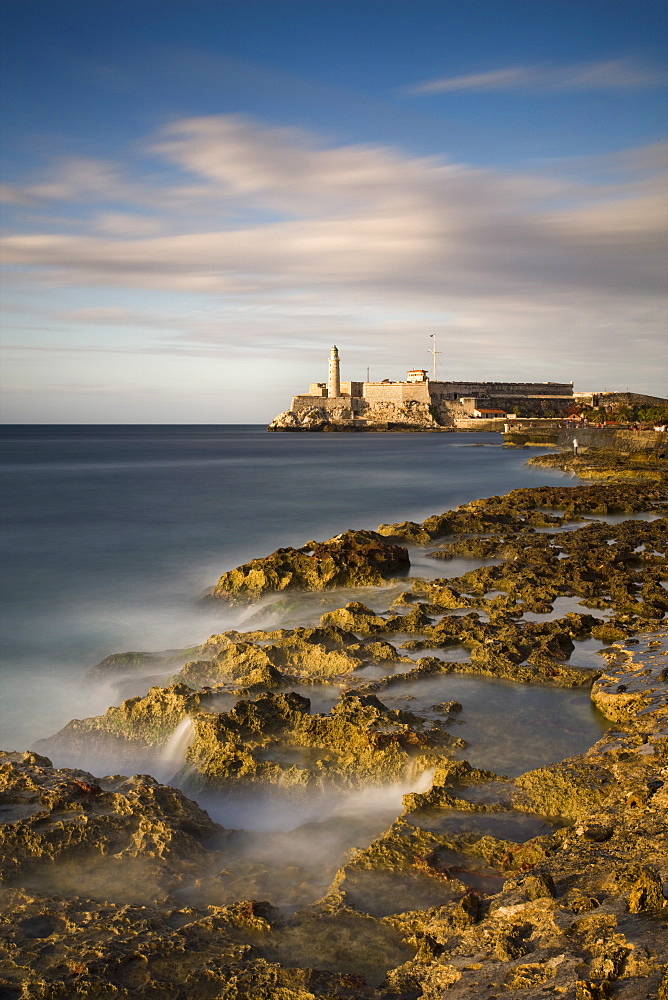 Evening view from The Malecon towards the Castillo de San Salvador de la Punta, Havana, Cuba, West Indies, Central America