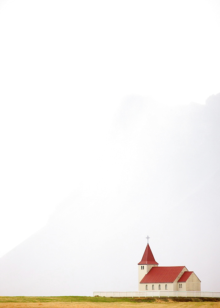 Isolated church with hazy outline of distant mountain in the background, Snaefellsnes Peninsula, Iceland, Polar Regions