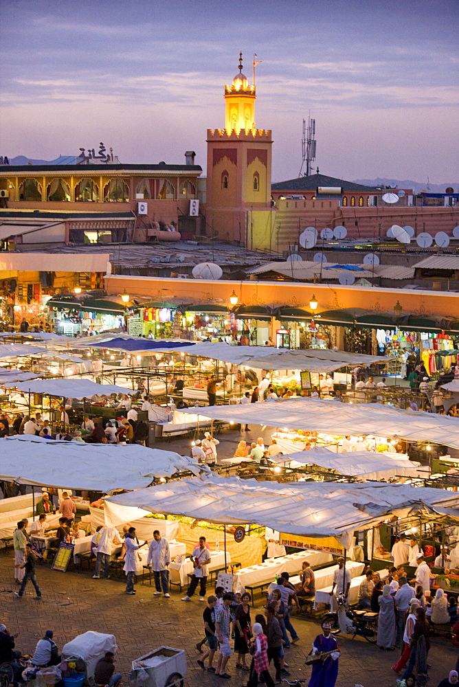 View over Djemaa el Fna at dusk with foodstalls that are set-up daily to serve tourists and locals, Marrakech, Morocco, North Africa, Africa