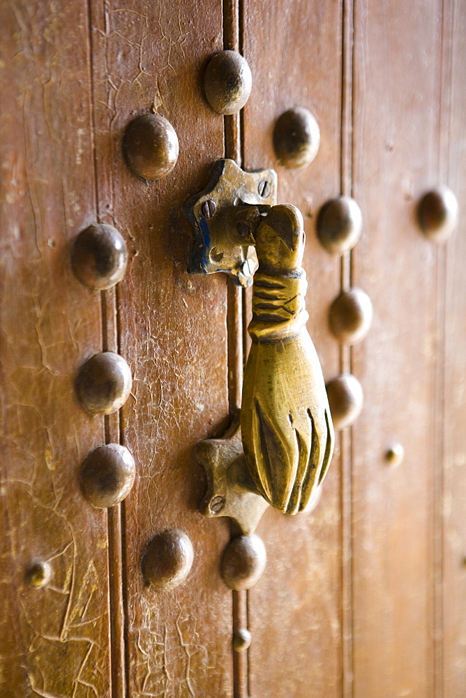 Brass Hand of Fatima door knocker, a popular symbol in Southern Morocco, Merzouga, Morocco, North Africa, Africa