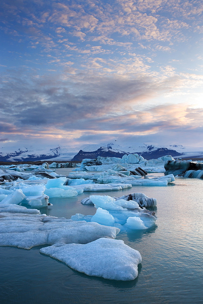 Sunset over Jokulsarlon, a glacial lagoon at the head of the Breidamerkurjokull Glacier on the edge of the Vatnajokull National Park, South Iceland, Iceland, Polar Regions