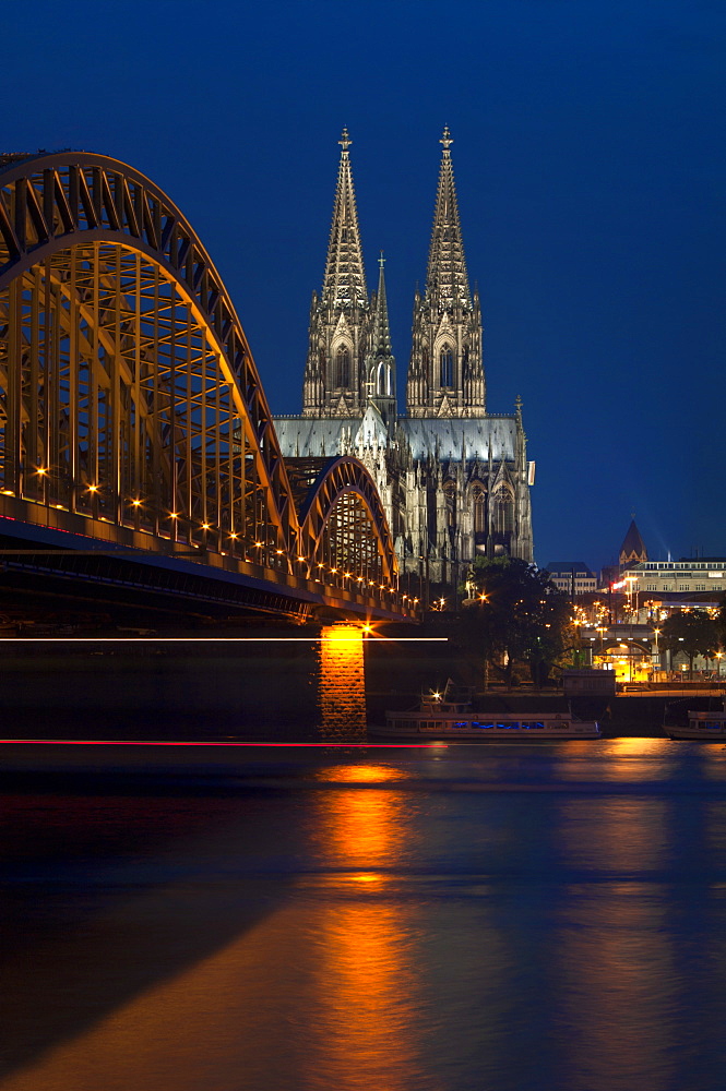 Cologne cathedral, UNESCO World Heritage Site, and Hohenzollern bridge at dusk, Cologne, Germany, Europe