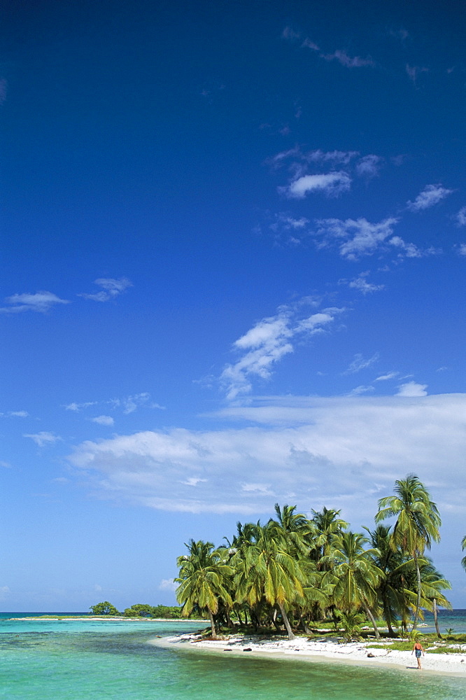 Lonely girl on beach, Laughing Bird Cay, Belize, Central America