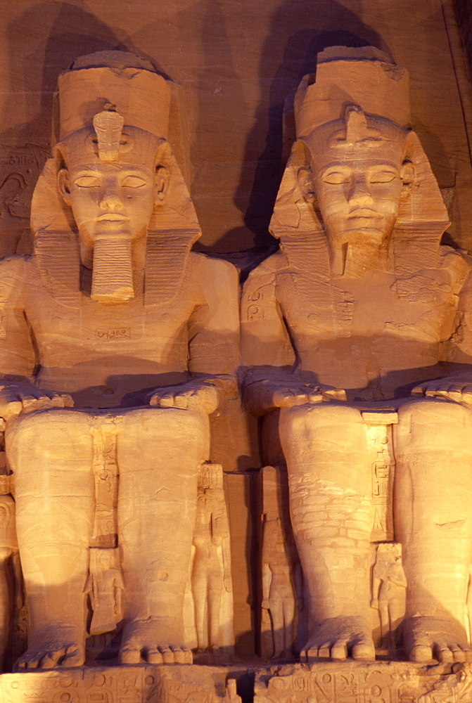 Floodlit colossi of Ramses II (Ramesses the Great), seated statues on facade of temple, Abu Simbel, UNESCO World Heritage Site, Nubia, Egypt, North Africa, Africa