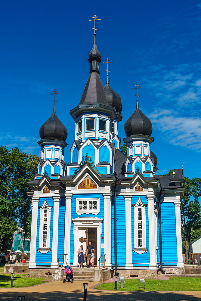 Family leaving Russian Orthodox Church at Drushkinkai, a spa town, Southern Lithuania, Europe