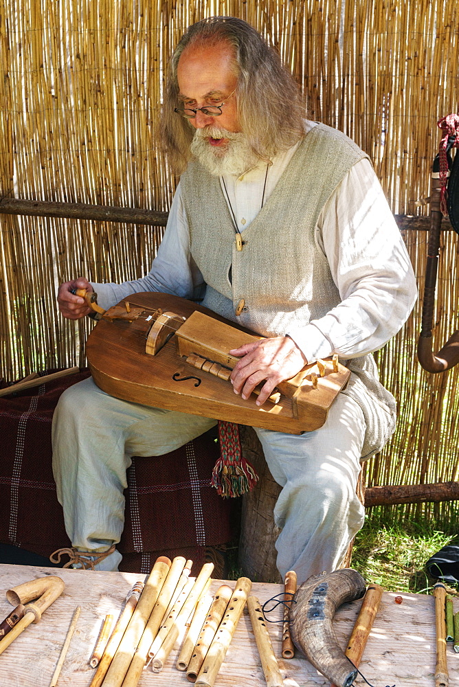 Lithuanian folk musician at the International Festival of Experimental Archaeology, Kernave, Lithuania, Europe