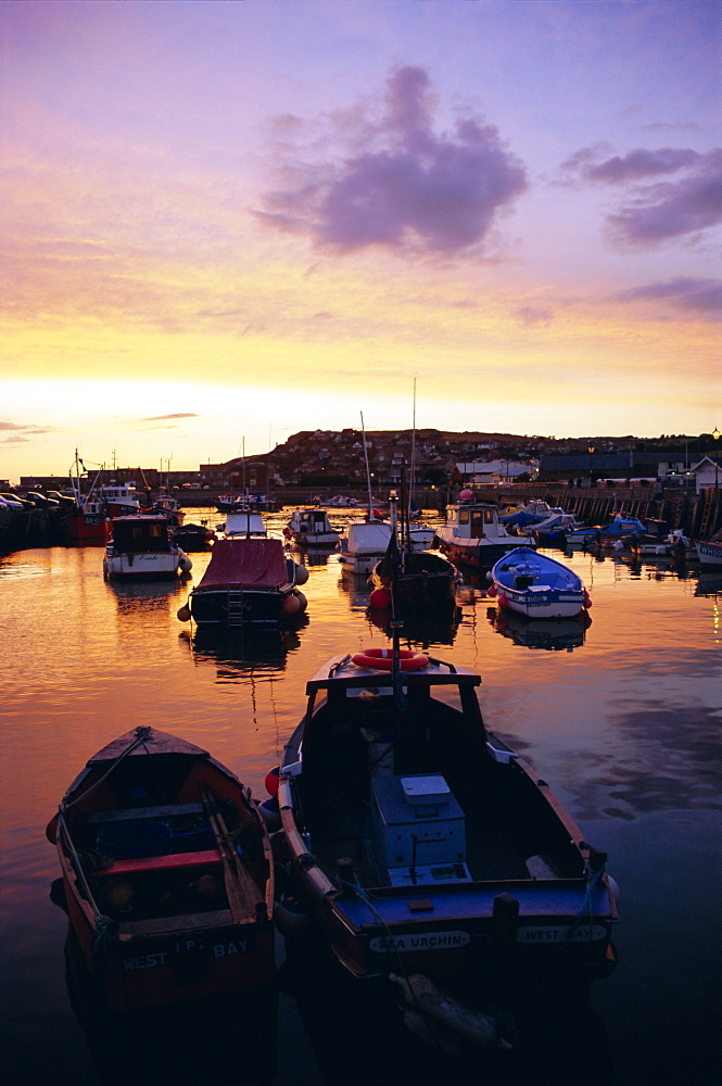 Harbour at sunset, West Bay, Dorset, England, UK, Europe