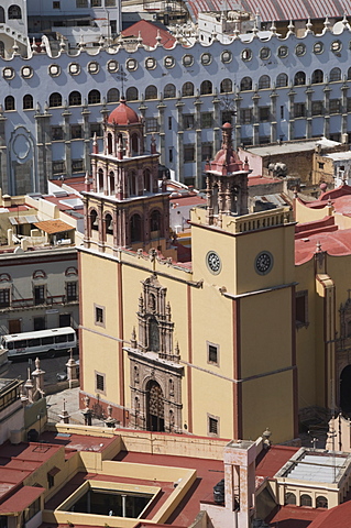 The Basilica de Nuestra Senora de Guanajuato, the yellow building in the foreground, with the blue grey building of the University of Guanajuato behind, Guanajuato, UNESCO World Heritage Site, Guanajuato State, Mexico, North America