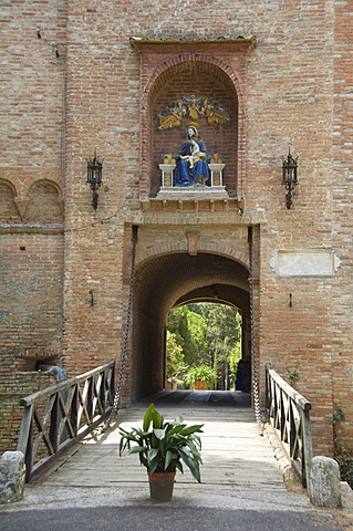 Entrance gatehouse at the Benedictine Monastery famous for frescoes in cloisters depicting the life of St. Benedict, Monte Oliveto Maggiore, Tuscany, Italy, Europe