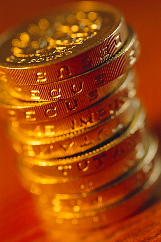 UK currency, stack of one pound coins 