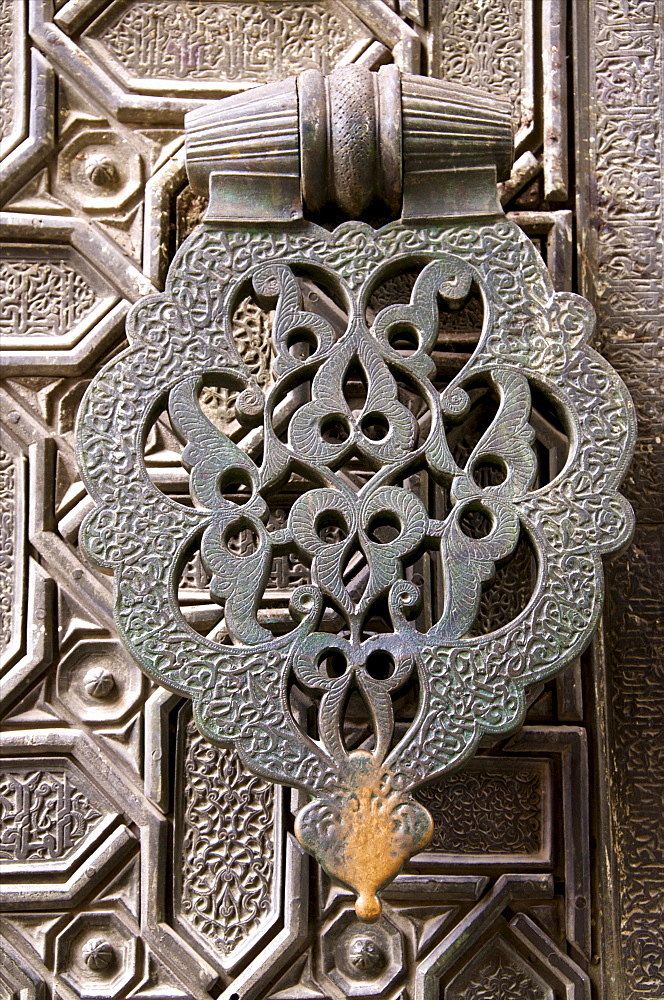 Bronze knocker on wooden engraved doors, Reales Alcazares, Seville, Andalucia, Spain, Europe