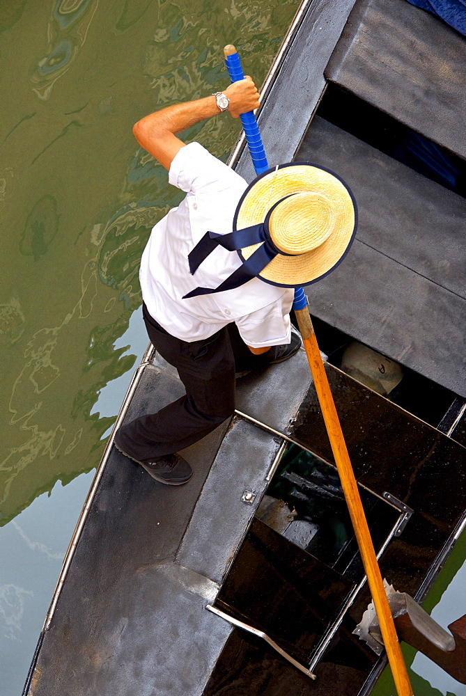 Gondolier on his gondola, Venice, UNESCO World Heritage Site, Veneto, Italy, Europe